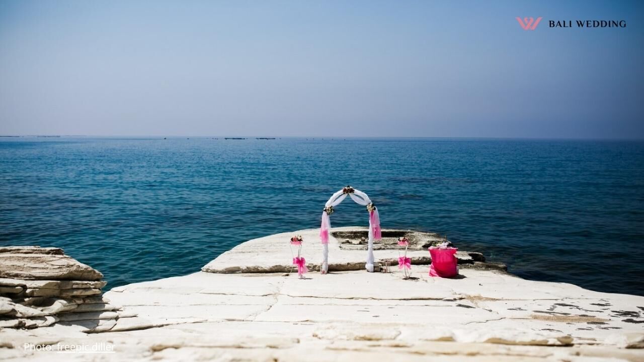 Pink wedding altar stands on the stones Pink wedding altar stands on the stones
